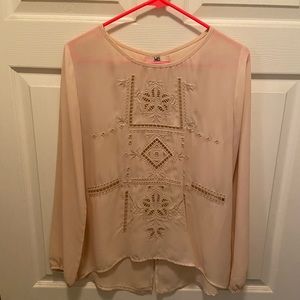 Cream colored long-sleeve laser blouse